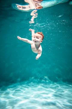 Cute Kid Dives in the Pool. Copy Space Stock Photos