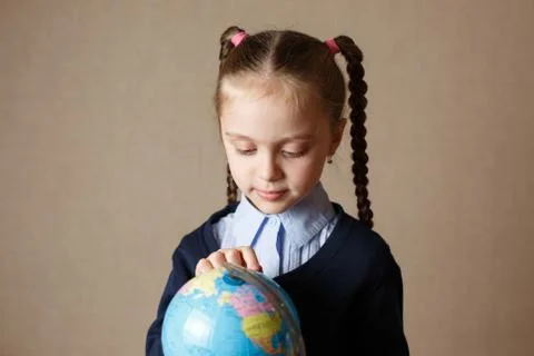 Cute kid with globe. Stock Photos