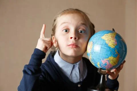Cute kid with globe. Stock Photos