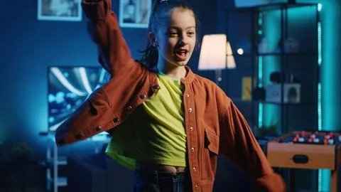 Cute kid pressing record button on filming equipment, doing dance tutorial 스톡 사진