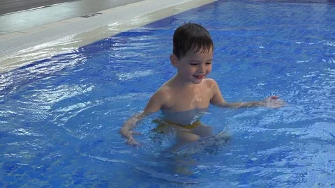 Cute kid swimmins in the pool Video stock 73441282