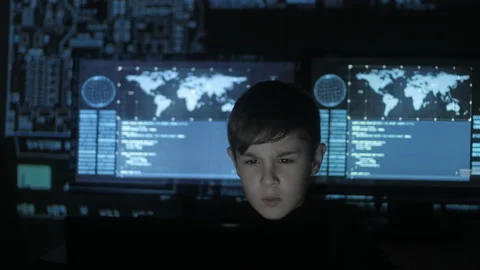 Cute kid young prodigy programmer working at a computer in the data center Stock Footage 86442505