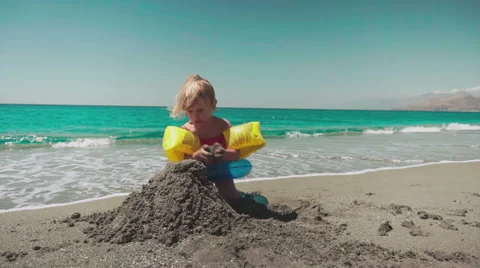 Cute Kids Having Fun on Beach and Playing with Sand 動画素材 60383306
