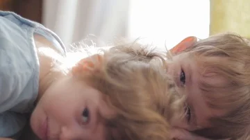 Cute kids lying on the floor Stock Footage 85595031