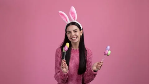 Cute lady in bunny costume easter gift eggs isolated on pastel color background Video stock 234309741