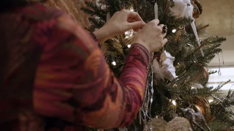Cute lady is decorating the Christmas tree Video stock 85882863