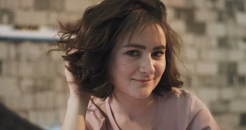 A cute lady portrait in front of the camera smiling large and feeling pretty Stock Footage 107786205