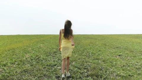 Cute lady walking through the meadow Video stock 95935541