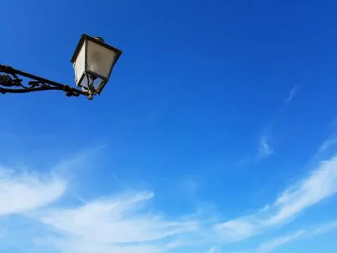 Cute lamp post against deep blue sky Stock Photos