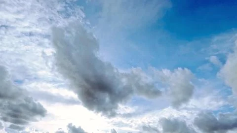 Cute large white clouds in the blue sky bg - photo of nature Stock Photos