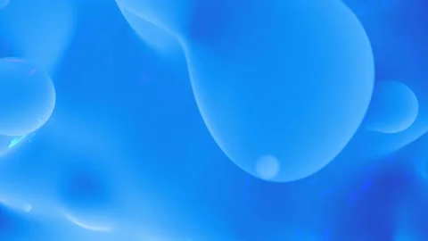 Cute light blue smooth wax elements - loop video Stock Footage 238400427