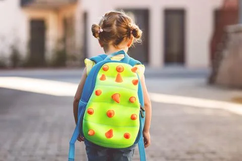 Cute little adorable toddler girl on her first day going to playschool. Healthy Stock Photos