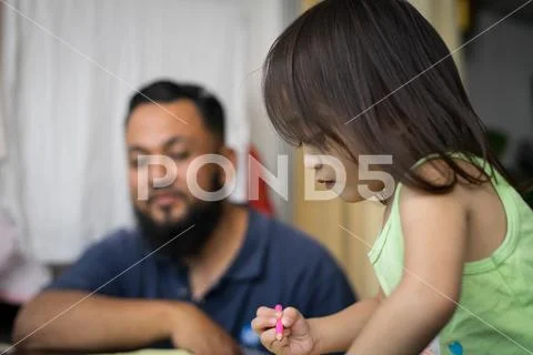 Cute little Asian 2 - 3 years old toddler girl child painting, kid coloring w Stock Photos
