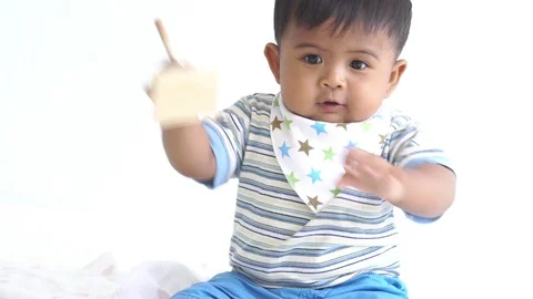 Cute little baby boy playing wooden toy at room Stock Footage 108572353