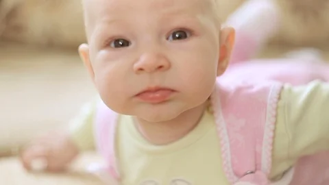 A cute little baby is looking into the camera. Stock Footage 95927904