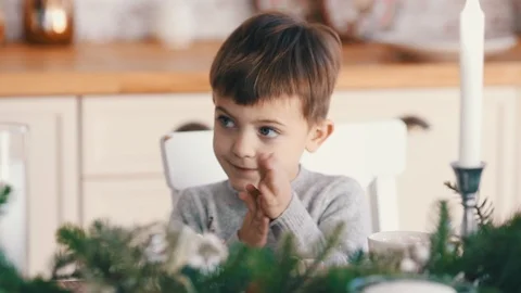 Cute little boy are expecting for his breakfast Stock Footage 120760596