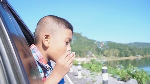 Cute little boy blowing bubble soap Stock Footage 91877522