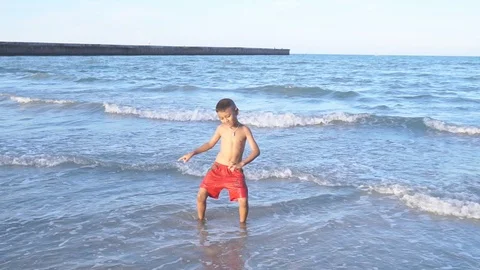 Cute little boy dancing on the beach Stock Footage 91868000