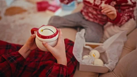 Cute little boy drinking hot chocolate with marshmallow at home. Stock Footage 166627737