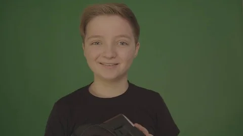 Cute little boy gesturing happily using VR virtual reality 360 degrees glasses Video stock 84640055