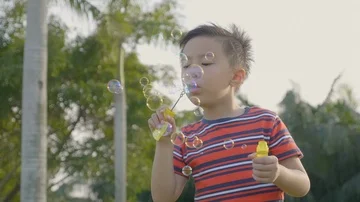 Cute little boy having fun with bubble. Stock Footage 86010014