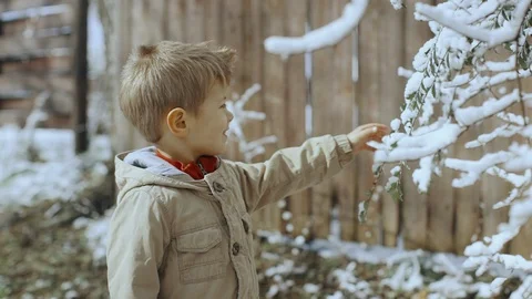 Cute little boy having fun outdoors in snow park. Portrait of funny child Video stock 104924898