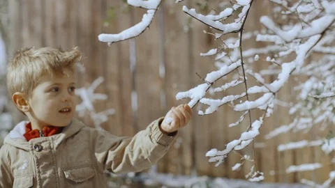 Cute little boy having fun outdoors in snow park. Portrait of funny child Stock-Footage 104925290