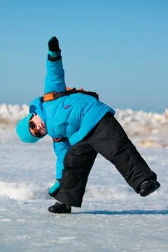 Cute little boy having fun on cold winter day Stock Photos
