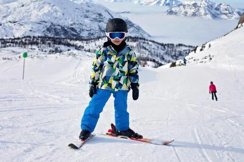Cute little boy, learning to ski in Austrian ski resort Stock Photos