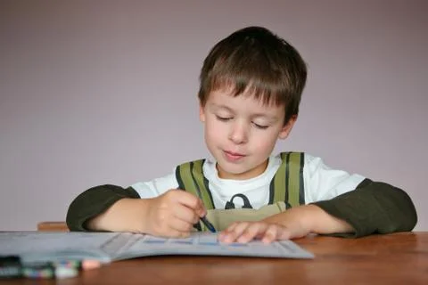 Cute little boy learning to write Stock Photos