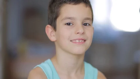 Cute little boy looking at camera Stock Footage 111970576