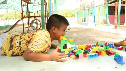 Cute little boy play block toy  at playground Stock Footage 73714875