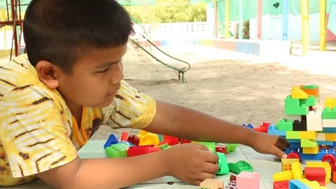 Cute little boy play block toy  at playground Stock Footage 73714877
