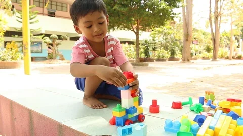 Cute little boy play block toy  at playground Stock Footage 73715397