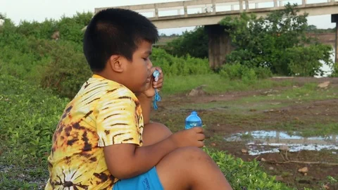 Cute little boy play bubble at river Stock Footage 73720863
