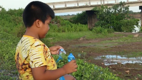 Cute little boy play bubble at river Stock Footage 73720897