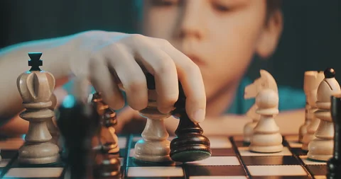 Cute little boy playing chess at home. Smart kids. Game good for brain Stock Footage 231822844