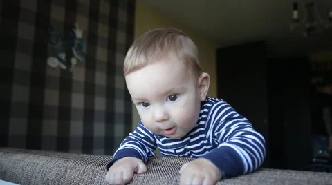Cute Little Boy Playing On The Couch Stock Footage 63371116