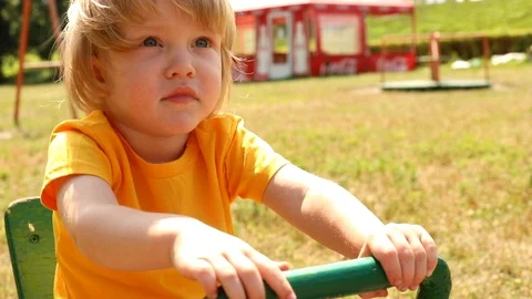 Cute little boy playing on kids playground in summer sunny day. Cheerful child 스톡 동영상 113686769