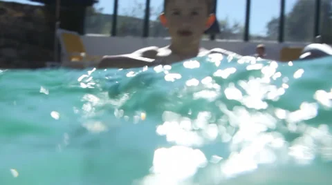 Cute little boy playing in the pool on summer vacation 動画素材 32936293