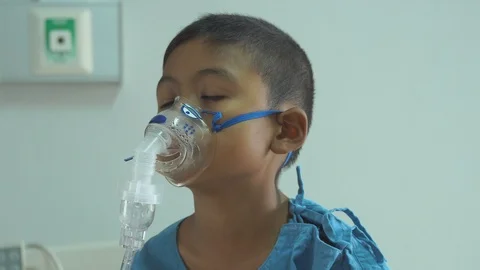 Cute little boy sick nebulizer Stock Footage 102408191