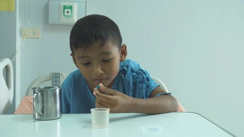 Cute little boy sick take a medicine Stock Footage 102409598