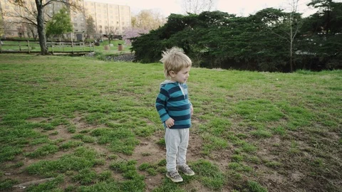 Cute Little Boy Sits Close To Water, Enjoys Looking At Scenery Stock-Footage 86797644