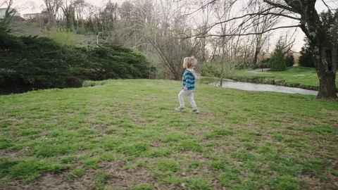Cute Little Boy Sits Close To Water, Enjoys Looking At Scenery Stock-Footage 86801044