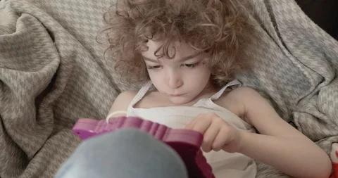 A cute little boy slouched back or reclining on a sofa drawing Stock-Footage 115961781