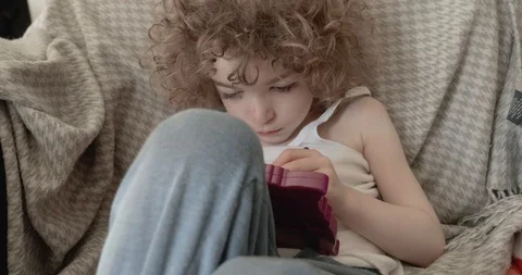 A cute little boy slouched back or reclining on a sofa drawing Stock-Footage 115961870