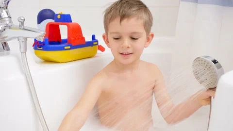 Cute little boy taking bath with foam an... | Stock Video