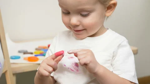 Cute little boy (toddler, two years old) is painting Video stock 102378449