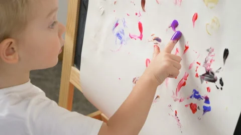 Cute little boy (toddler, two years old) is painting 스톡 동영상 102383032