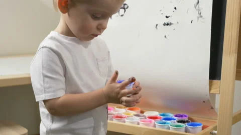 Cute little boy (toddler, two years old) is painting 動画素材 102492306